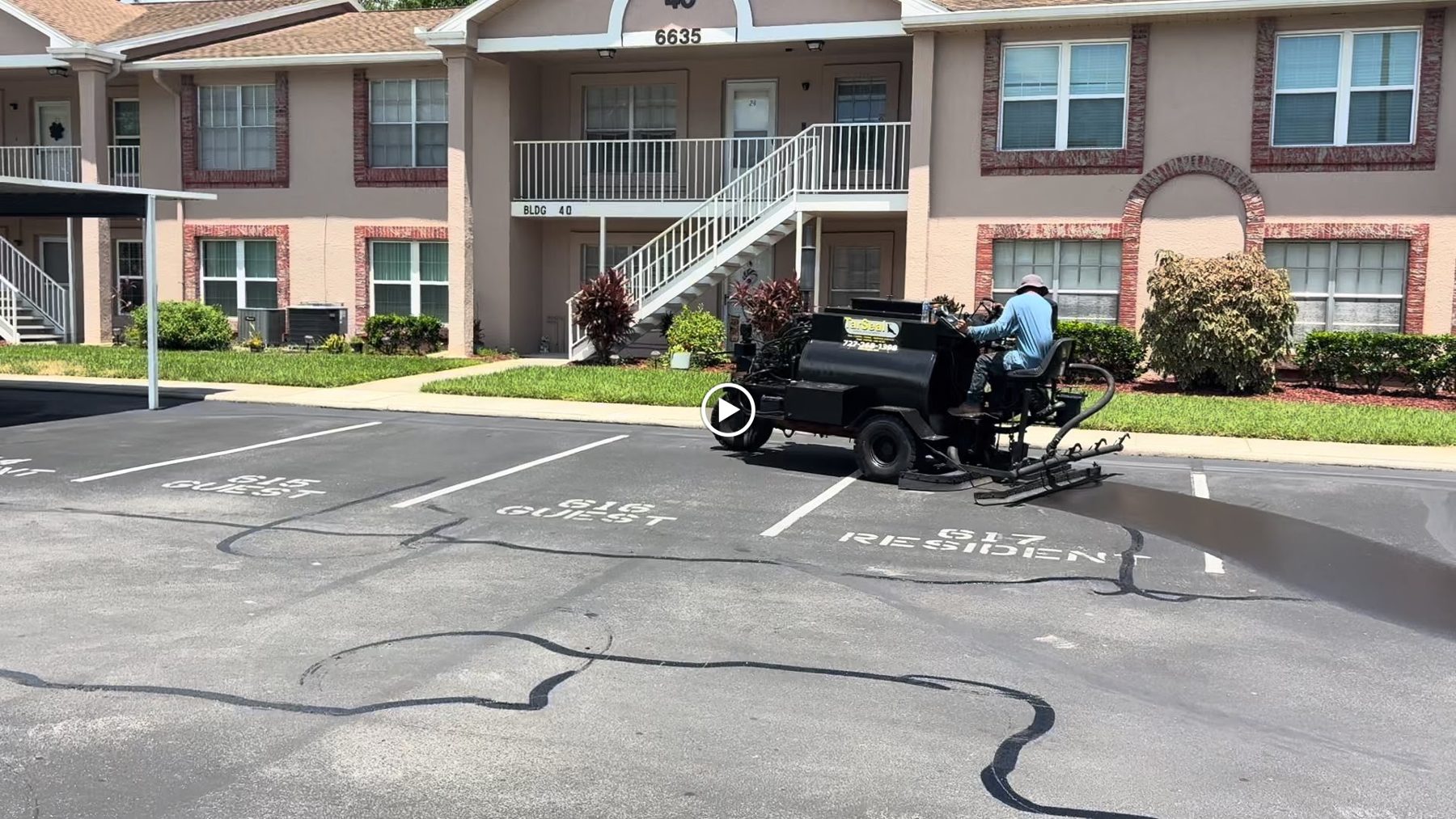 Tar Seal crew crack filling a commercial parking lot